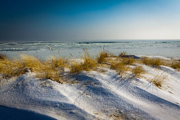 istock Winter sunrise in frosen beach 153830404