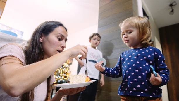 istock Child eating birthday cake. 1538313235