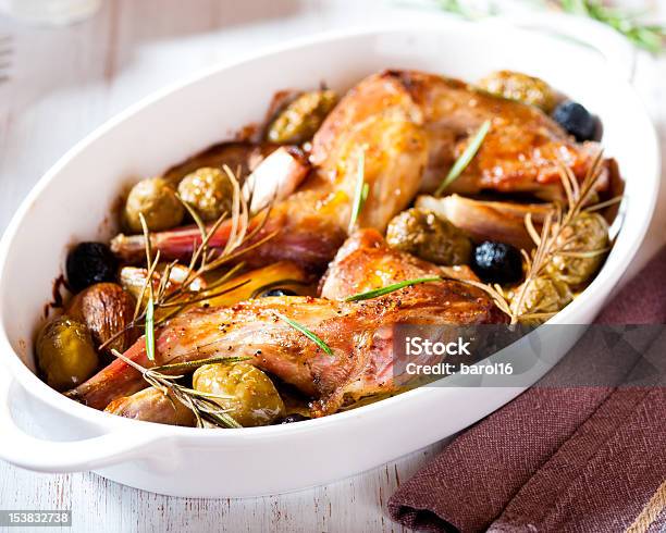 Oven Baked Rabbit Legs With Olives And Rosemary Stock Photo - Download Image Now - Baked, Rabbit - Game Meat, Black Olive