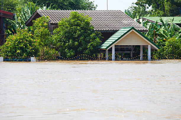 istock flood waters overtake a house 153833477