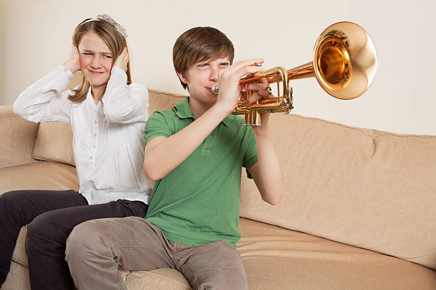 Annoying trumpet player stock photo