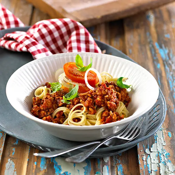 Pasta meatsauce on old table