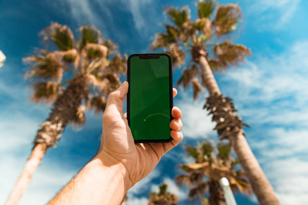 Mobile phone fallen and lost in the sand
