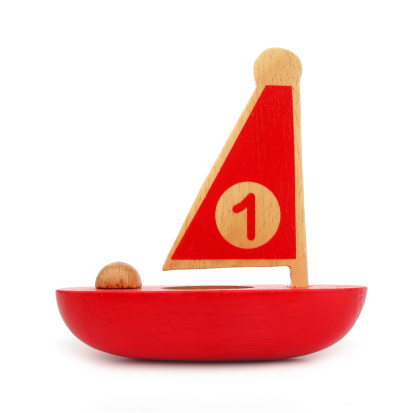 This is a wooden toy, red sailboat with number one on sail.