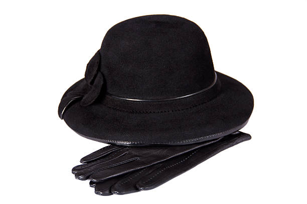 istock Female hat lying on the leather gloves (isolated) 153838641