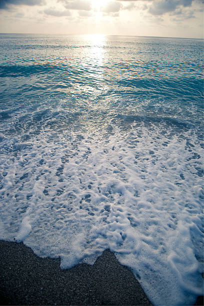 Sea and sunset on beach stock photo