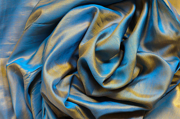 カラフルなシルク - blue silk focus on foreground abstract ストックフォトと画像
