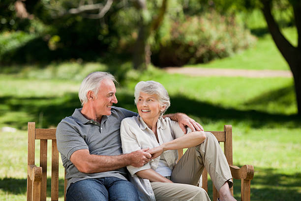 istock Senior couple sitting on a bench 153856337