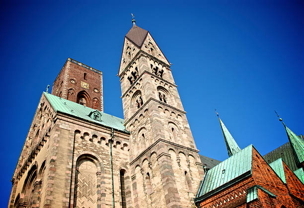 Ribe Cathedral Impressive exterior of the ancient Ribe Cathedral (Ribe Domkirke) under an intense blue sky, Ribe, Denmark. ribe town photos stock pictures, royalty-free photos & images