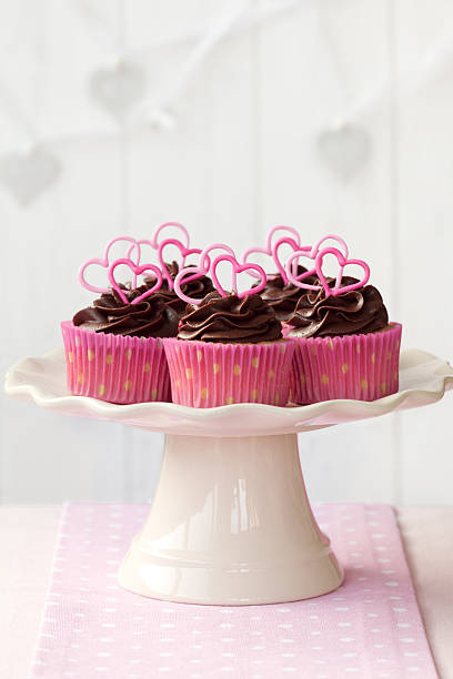 istock Valentine cupcakes with chocolate and candy hearts 153858154