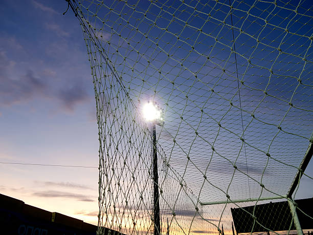 istock Lighting pylons at football stadium 153858193