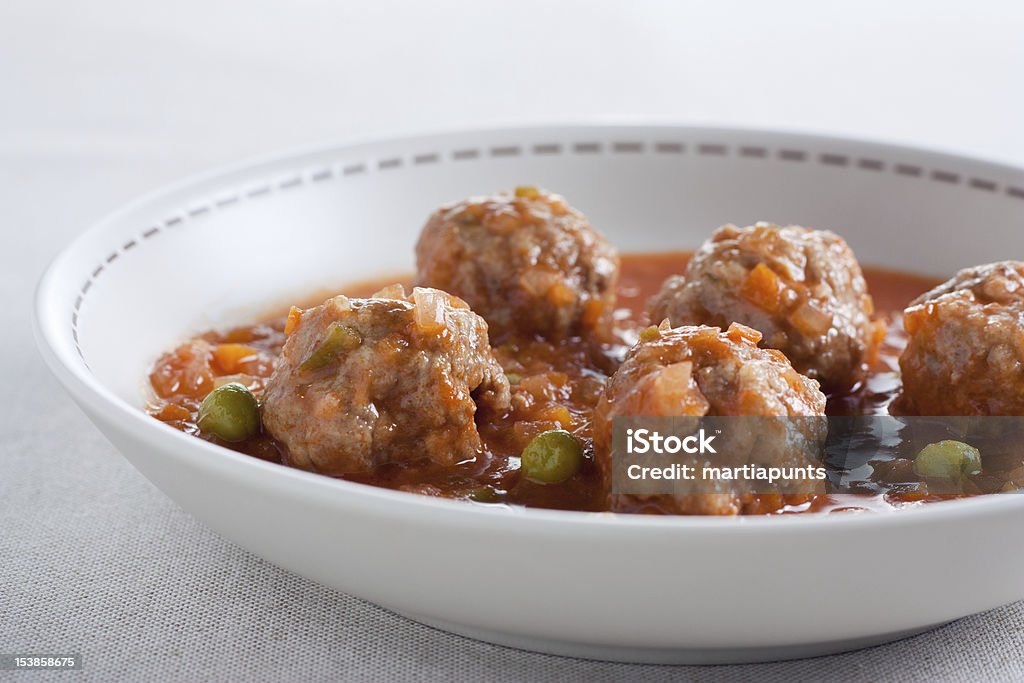 Stewed meatballs with peas, tomato and onion. Stewed meatballs with peas, tomato and onion. Traditional dish Beef Stock Photo