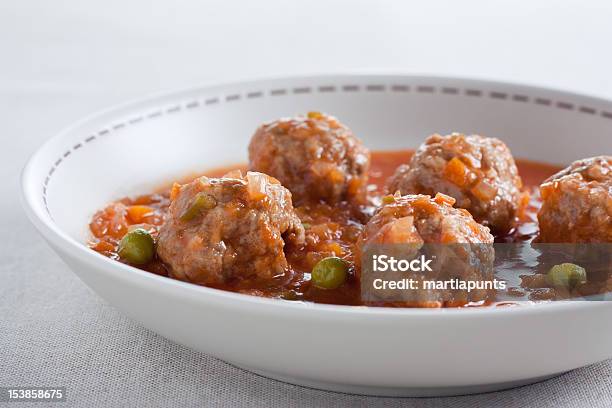 Stewed Meatballs With Peas Tomato And Onion Stock Photo - Download Image Now - Beef, Beef Stew, Crockery