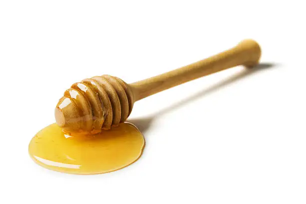 Honey dipper isolated on white