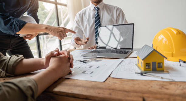 istock engineer team working in office with blueprints, inspection in workplace for architectural plan, construction project ,Business construction 1538622497