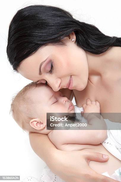 Picture Of Happy Mother With Baby Over White Stock Photo - Download Image Now - Adult, Baby - Human Age, Beautiful People