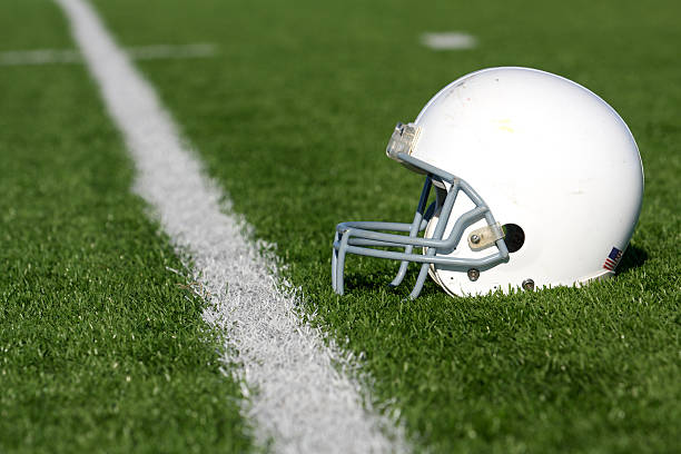 istock American Football Helmet on Field 153867270