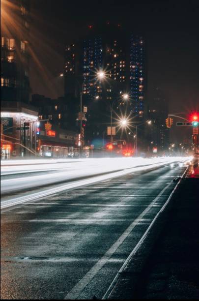 istock Car lights in city 1538673547