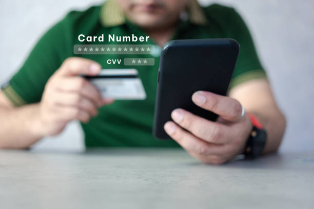 istock Man typing a credit card dialing number and card verification value for payment 1538685989