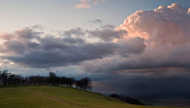 istock Stunning landscape with stormy sky over rural hills 153870608