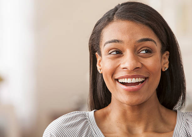istock Young woman smiling at home 153870979
