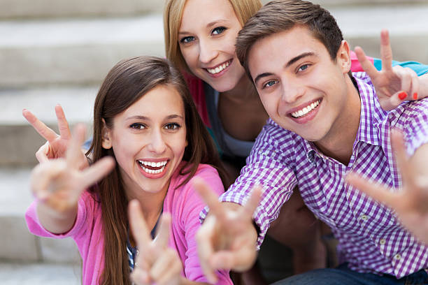 istock Friends showing peace sign 153871113