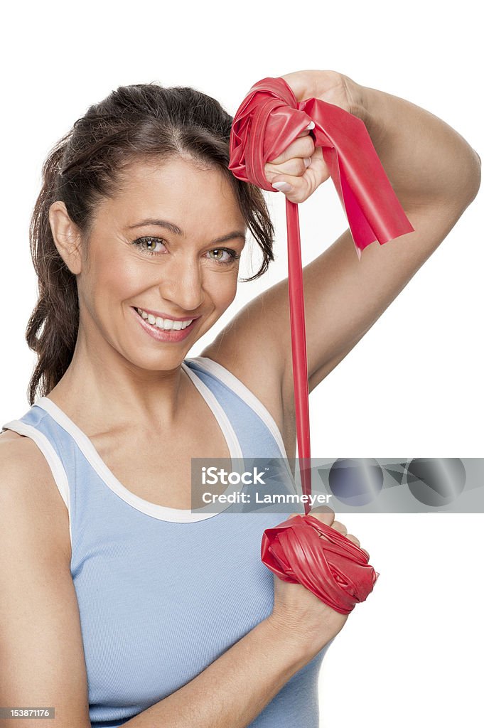 Mujer con rojo Banda de caucho - Foto de stock de Gimnasia libre de derechos