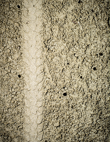 Close-up of several tire skid marks on asphalt