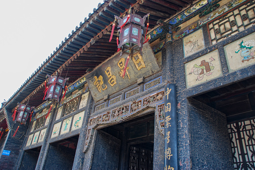 Pingyao, Shanxi, China- April 7, 2012: The Ancient City of Ping Yao is a well-preserved ancient county-level city in China. It is located in Ping Yao County, central Shanxi Province. The Ancient City of Ping Yao well retains the historic form of the county-level cities of the Han people in Central China from the 14th to 20th century. Here is the Rishengchang Bank, so called the First Bank of China. It literally means ‘Sunrise Prosperity’. Rishengchang Bank was the forerunner for organizing China’s early financial system and handling financial business, including remittances, money exchange, deposits, and loans.