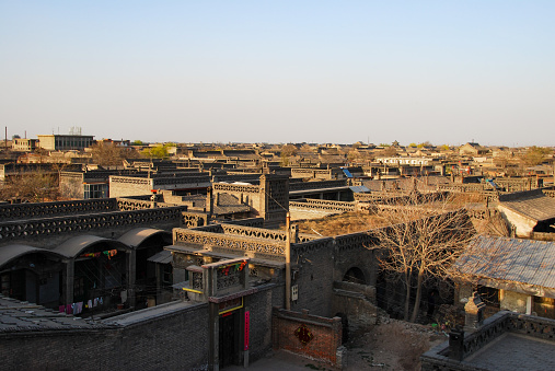 Pingyao, Shanxi, China- April 7, 2012: The Ancient City of Ping Yao is a well-preserved ancient county-level city in China. It is located in Ping Yao County, central Shanxi Province. The Ancient City of Ping Yao well retains the historic form of the county-level cities of the Han people in Central China from the 14th to 20th century. Here is the ancient street bird view seen from the citywall of Pingyao ancient town.
