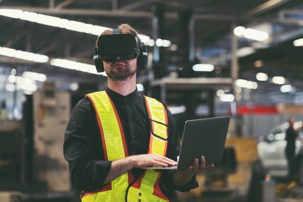 istock Male factory mechanic using virtual reality headset. Male engineer working or using virtual reality headset for checking machinery in industry factory and wearing safety uniform and helmet 1538808940