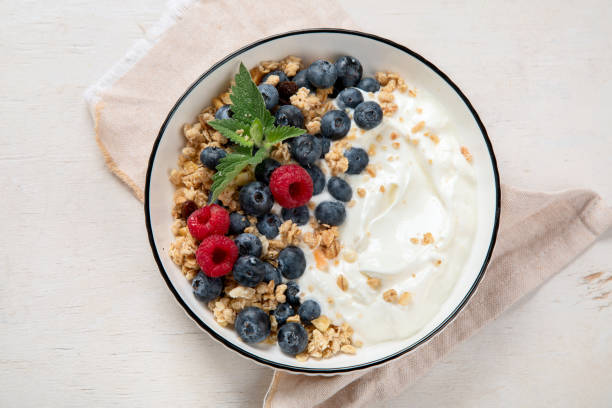 istock Healthy breakfast, cereal with berries and yogurt. 1538820070
