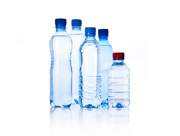 istock Group plastic bottles of water isolated on white 153882373