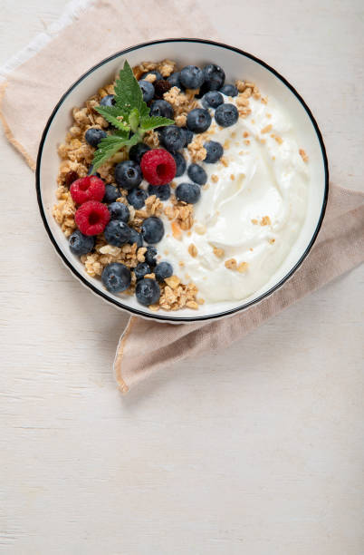 istock Healthy breakfast, cereal with berries and yogurt. 1538829297