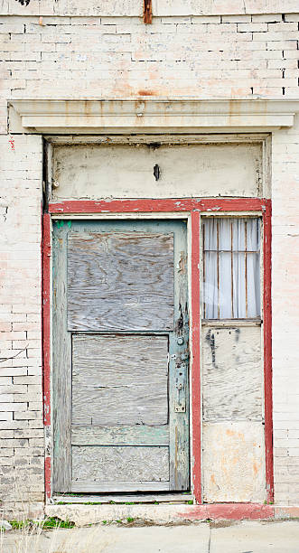 istock dilapated door with red trim 153885906