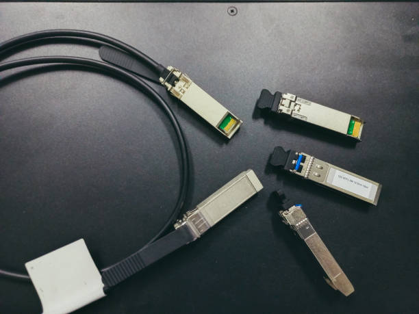 SFP Optical Transceiver Module. A transceiver device used in computer networking and automation. SFP Optical Transceiver Module. A transceiver device used in computer networking and automation. computer network router communication internet stock pictures, royalty-free photos & images