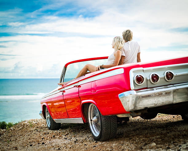 istock Couple on the cliff sitting in car 153886491