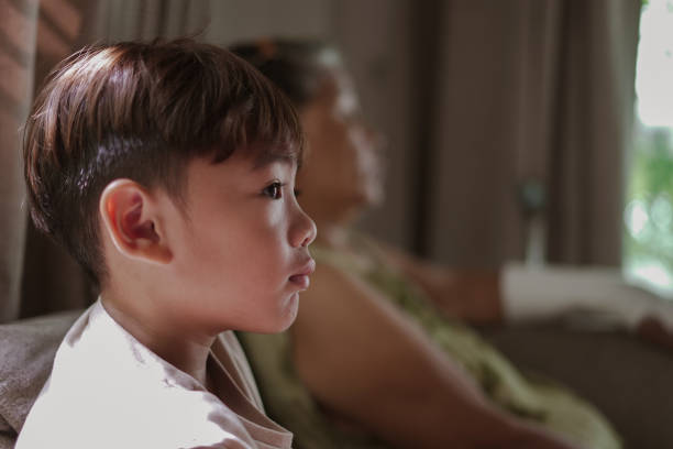 istock Boy and Grandma watching tv 1538877579