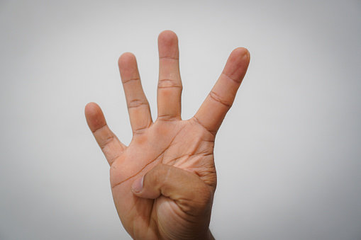 Man`s hand gesture, counting number Four , isolated on white background - part of set