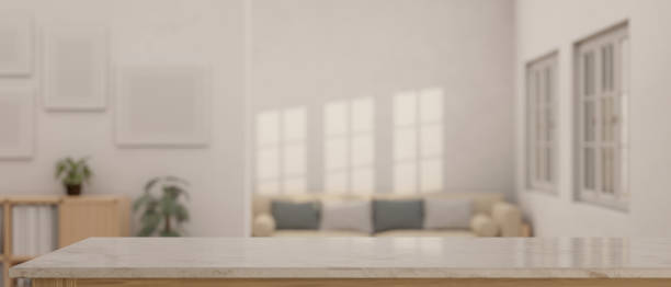 istock Empty space on a tabletop with a blurred minimal bright living room as a background. 1538879475