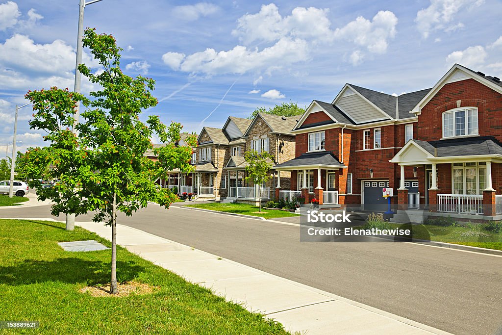 Suburban homes Suburban residential street with red brick houses Detached House Stock Photo