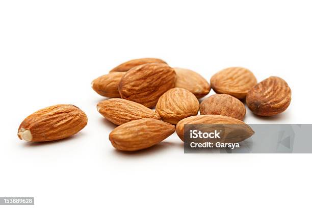 Almonds On The White Background Stock Photo - Download Image Now - Almond, Brown, Close-up