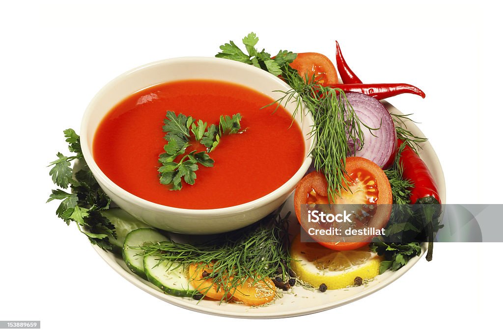 Tomato soup with vegetables Fresh tomato soup with different vegetables isolated on white Carrot Stock Photo