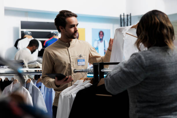 istock Clothing store client holding shirt 1538900122