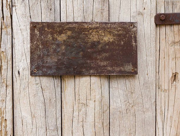 istock Old and rust metal sign on wood plank background 153890927