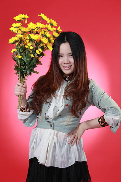 istock eautiful Chinese girl with many flowers. 153893354