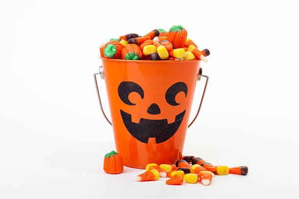 istock Bucket of Halloween Candy on White, Copy Space 153896282