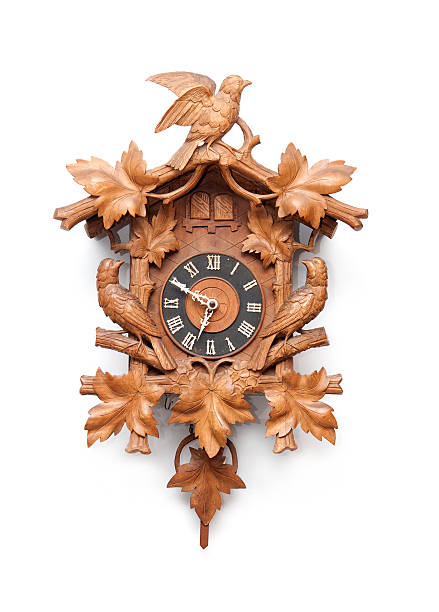 istock Old classic wooden cuckoo clock hung on a white wall 153896799