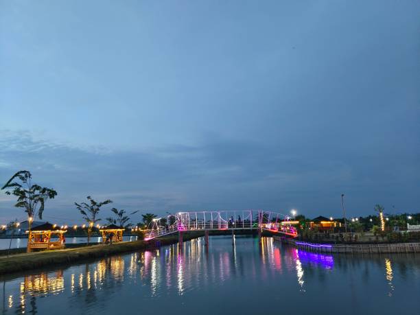 istock Reflection of colorful lights on the water 1538986503