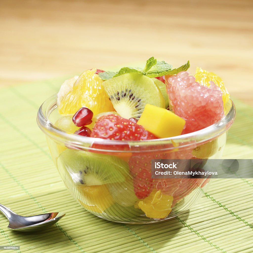 Fruit salad Healthy fruit salad in the glass bowl Apple - Fruit Stock Photo